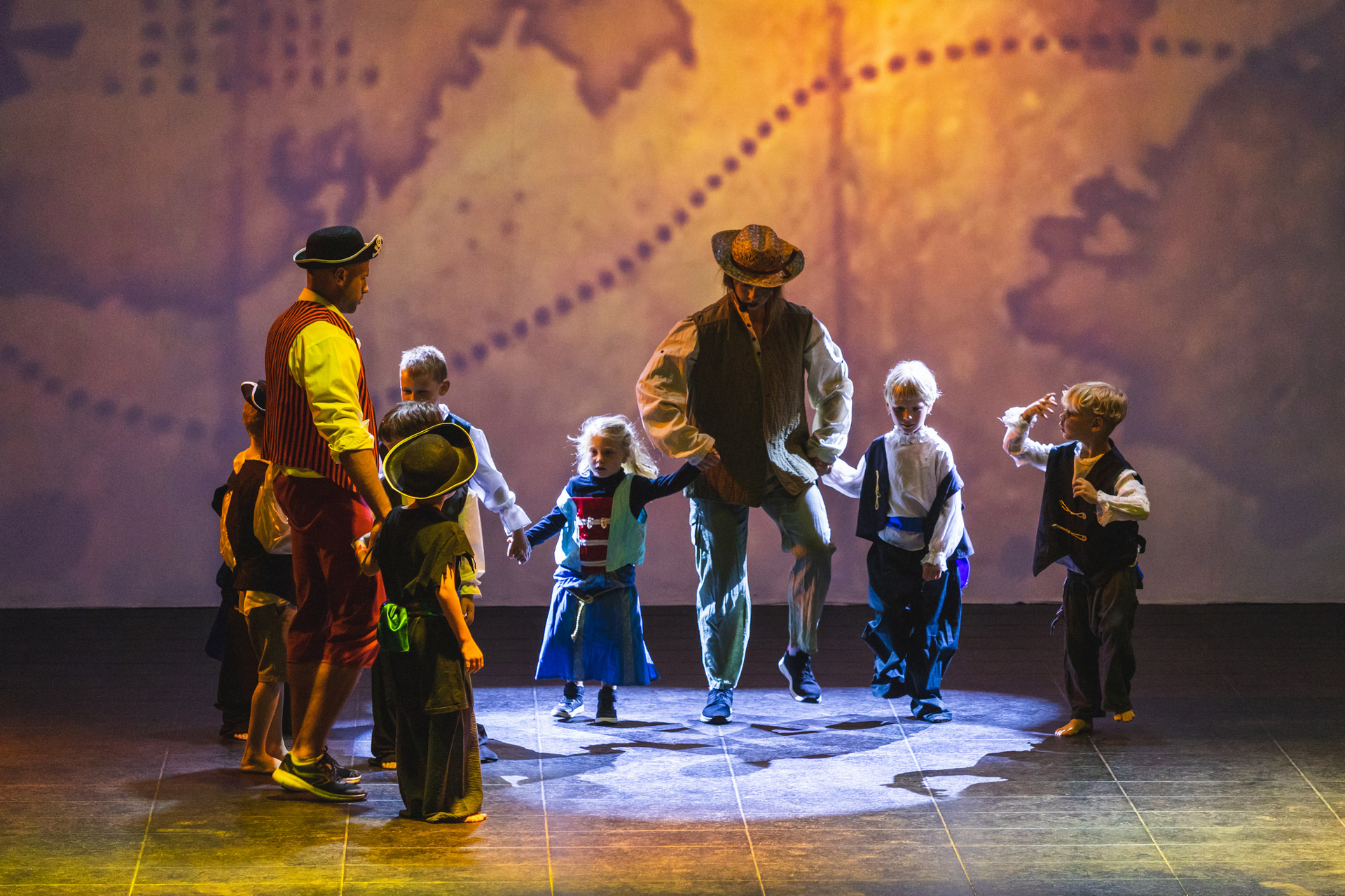 Zatonino entertaining children on stage during a live performance